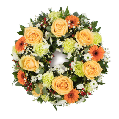 Wreath SYM-315 - A beautiful classic wreath arranged using peach and green flowers and finished with fine foliage.
